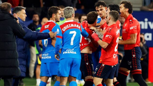 osasuna-s-kike-barja-clashes-with-atletico-madrid-s-marc-pubill.JPG
