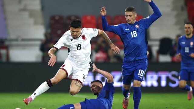 albania-s-mirlind-daku-in-action-with-serbia-s-milos-veljkovic-and-andrej-ilic.JPG
