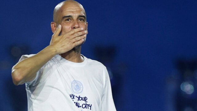 manchester-city-manager-pep-guardiola-celebrates-after-the-victory-parade.JPG