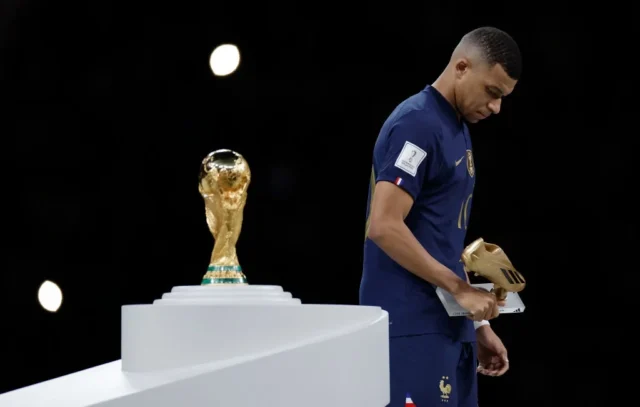 'Watching Kylian Mbappe score a World Cup final hat-trick, I can honestly say I didn’t care' Sir Geoff Hurst explains two reasons why he wasn’t upset to share his famous record in 2022 Kylian Mbappe walks past the World Cup trophy with his Golden Boot award in hand