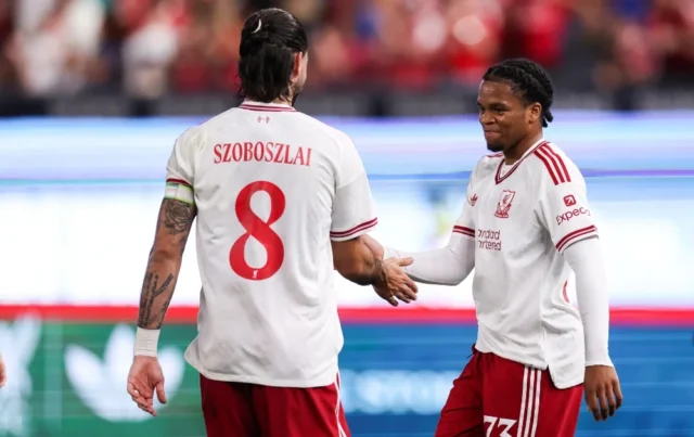 Rio Ngumoha #73 of Liverpool FC celebrates with teammate Dominik Szoboszlai #8 after scoring the team's first goal during the second half of the pre-season friendly against Wrexham