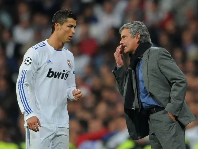 Jose Mourinho talking to Cristiano Ronaldo during a Real Madrid match