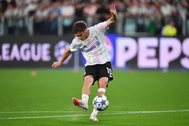 Kenan Yildiz: Juventus Plan Amid Arsenal Interest Kenan Yildiz in a Juventus kit kicking a soccer ball during a match