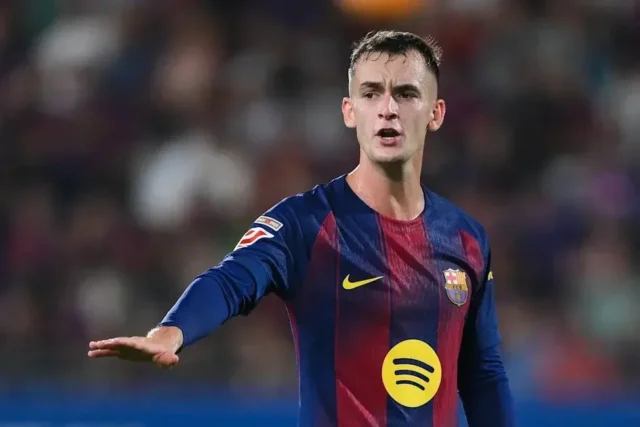 Héctor Fort joins Real Sociedad from Barcelona Marc Casadó in an FC Barcelona home kit during a match