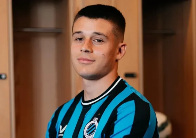 Portrait of Nicolo Tresoldi wearing a blue and black striped Club Brugge jersey