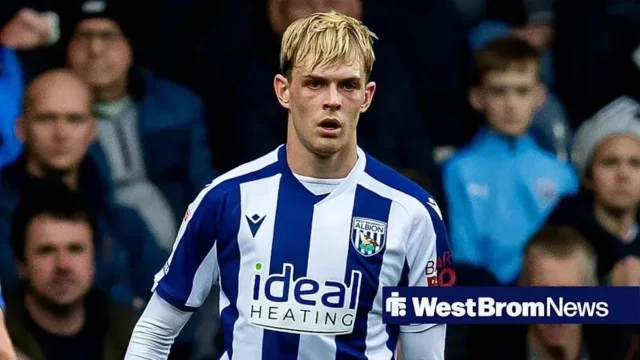 Toby Collyer in a West Bromwich Albion blue and white striped home kit during a match.