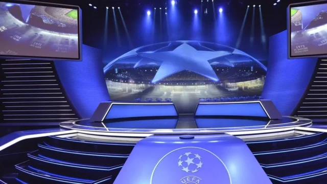 Barcelona Champions League opponents confirmed A high-tech blue stage set for the UEFA Champions League draw with large screens and the starball logo.